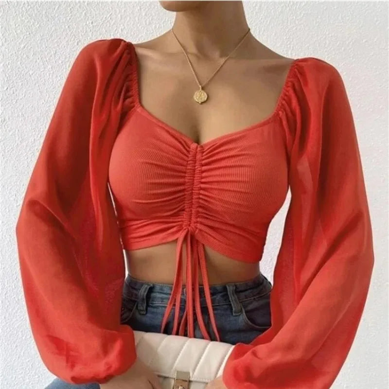 Maglietta donna  Maglietta sexy da donna con maniche a lanterna in rete e coulisse, con petto nudo e ombelico, maniche lunghe