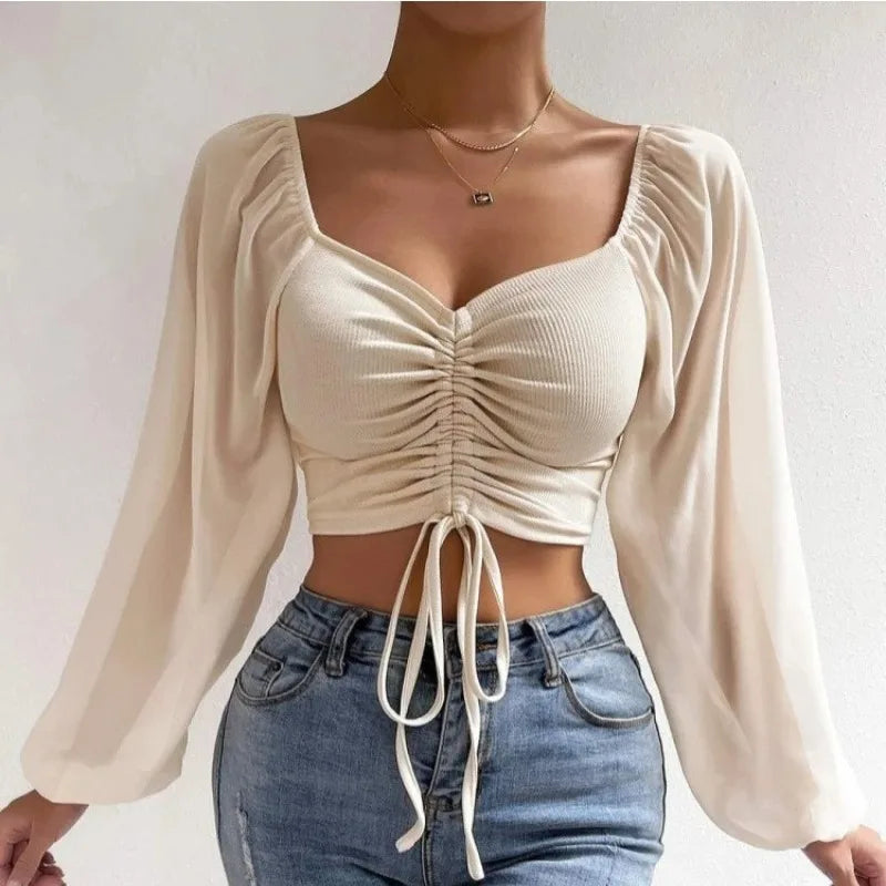 Maglietta donna  Maglietta sexy da donna con maniche a lanterna in rete e coulisse, con petto nudo e ombelico, maniche lunghe